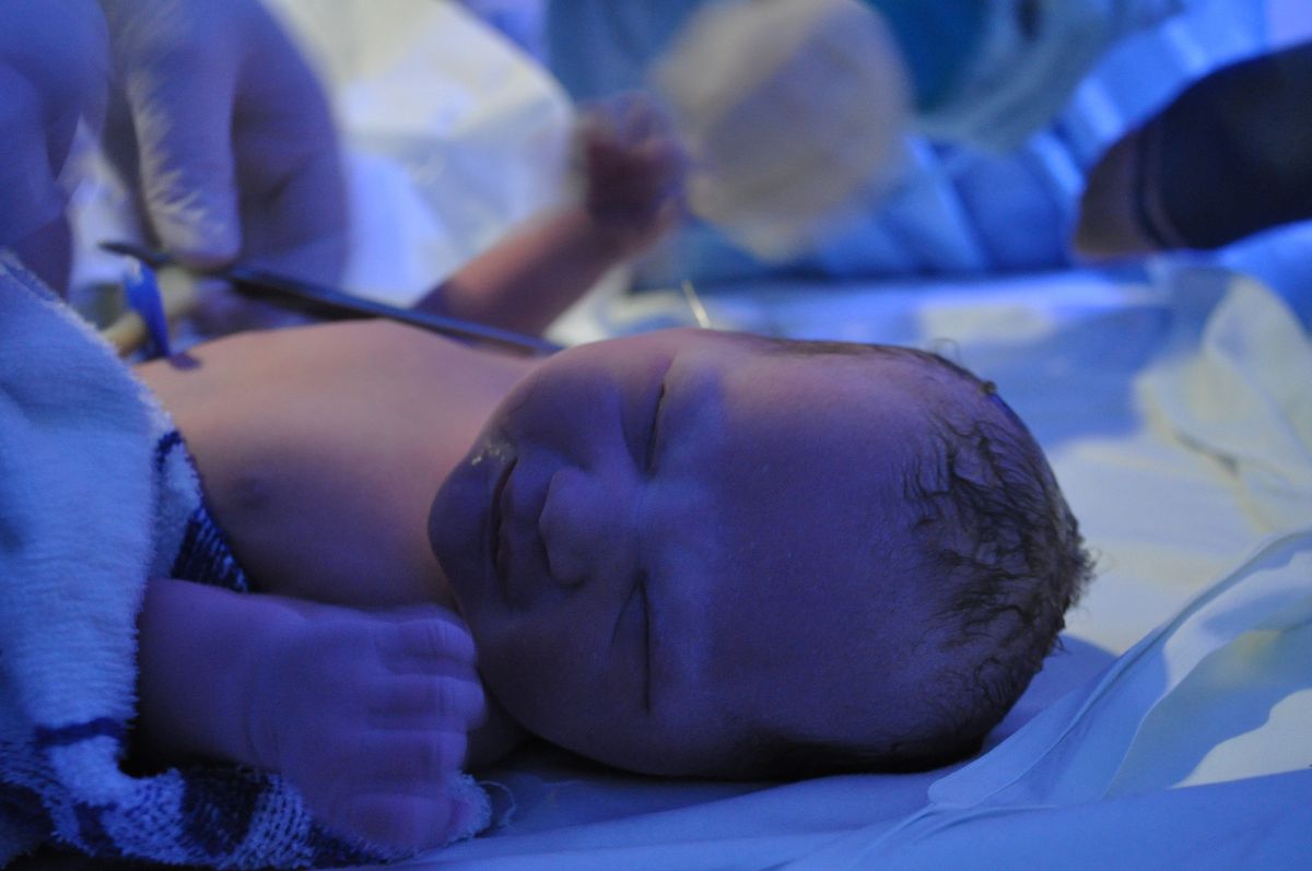 My Daughter, Ruby, 2 Minutes old, the lights in the room were blue for calm, she had not even had her cord cut, along with being at the birth of my 3 other children this is my best memory 